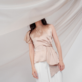 Golden Poise Top in 100% certified Como silk features an asymmetric bow and tailored silhouette, perfect for achieving both professional and evening elegance.