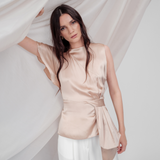 Golden Poise Top in 100% certified Como silk features an asymmetric bow and tailored silhouette, perfect for achieving both professional and evening elegance.