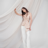 Golden Poise Top in 100% certified Como silk features an asymmetric bow and tailored silhouette, perfect for achieving both professional and evening elegance.