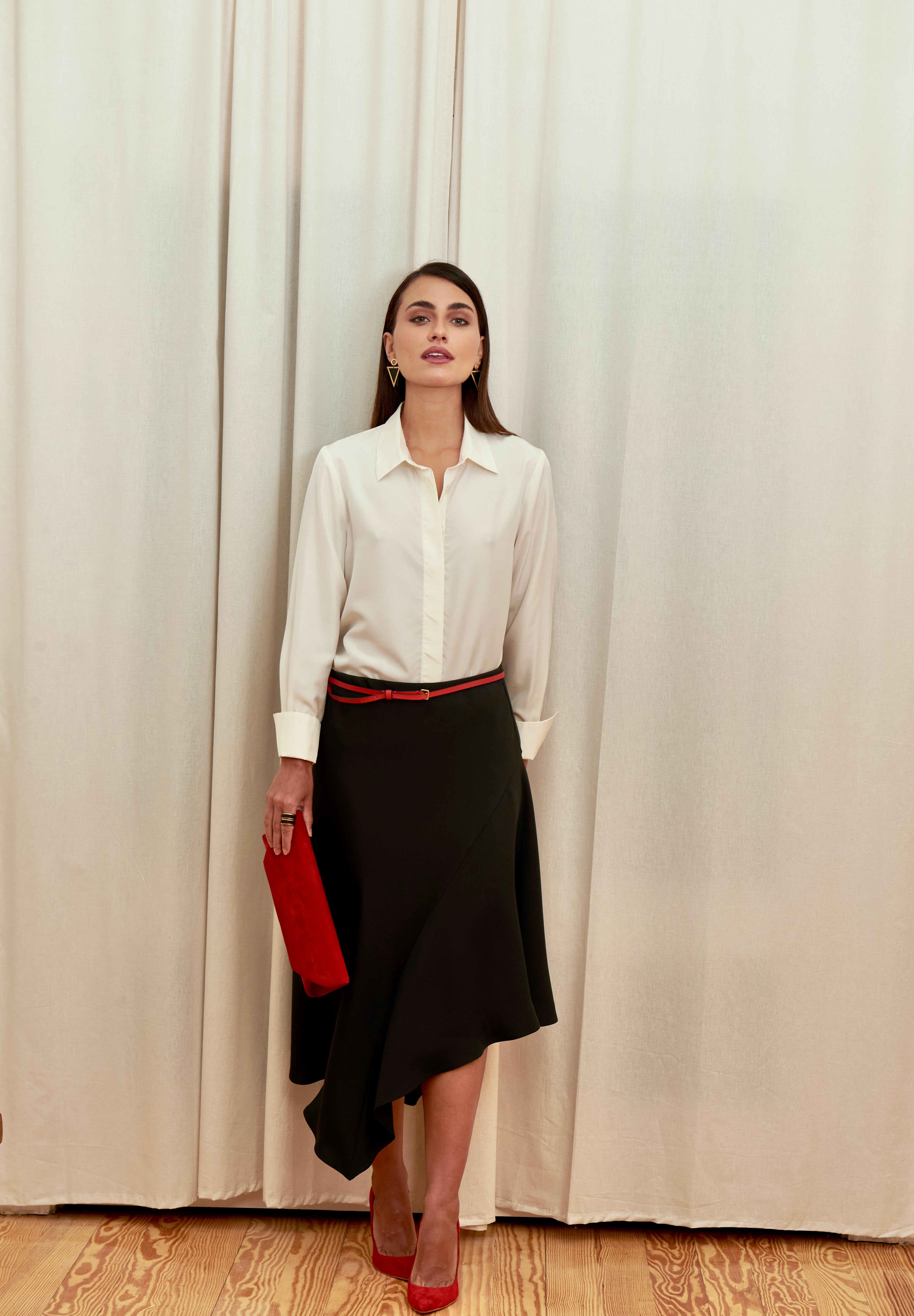 Celeste Cascade Skirt in 100% certified Como silk features an elasticated waistband and cascading hemline, offering refined elegance for day-to-night style.