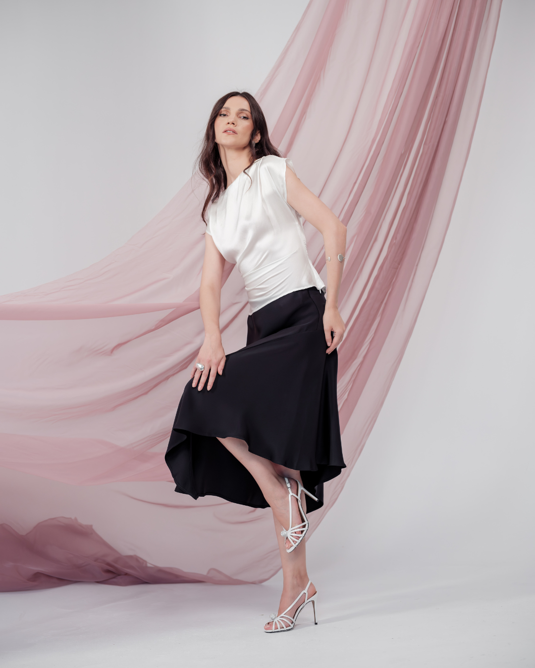Celeste Cascade Skirt in 100% certified Como silk features an elasticated waistband and cascading hemline, offering refined elegance for day-to-night style.