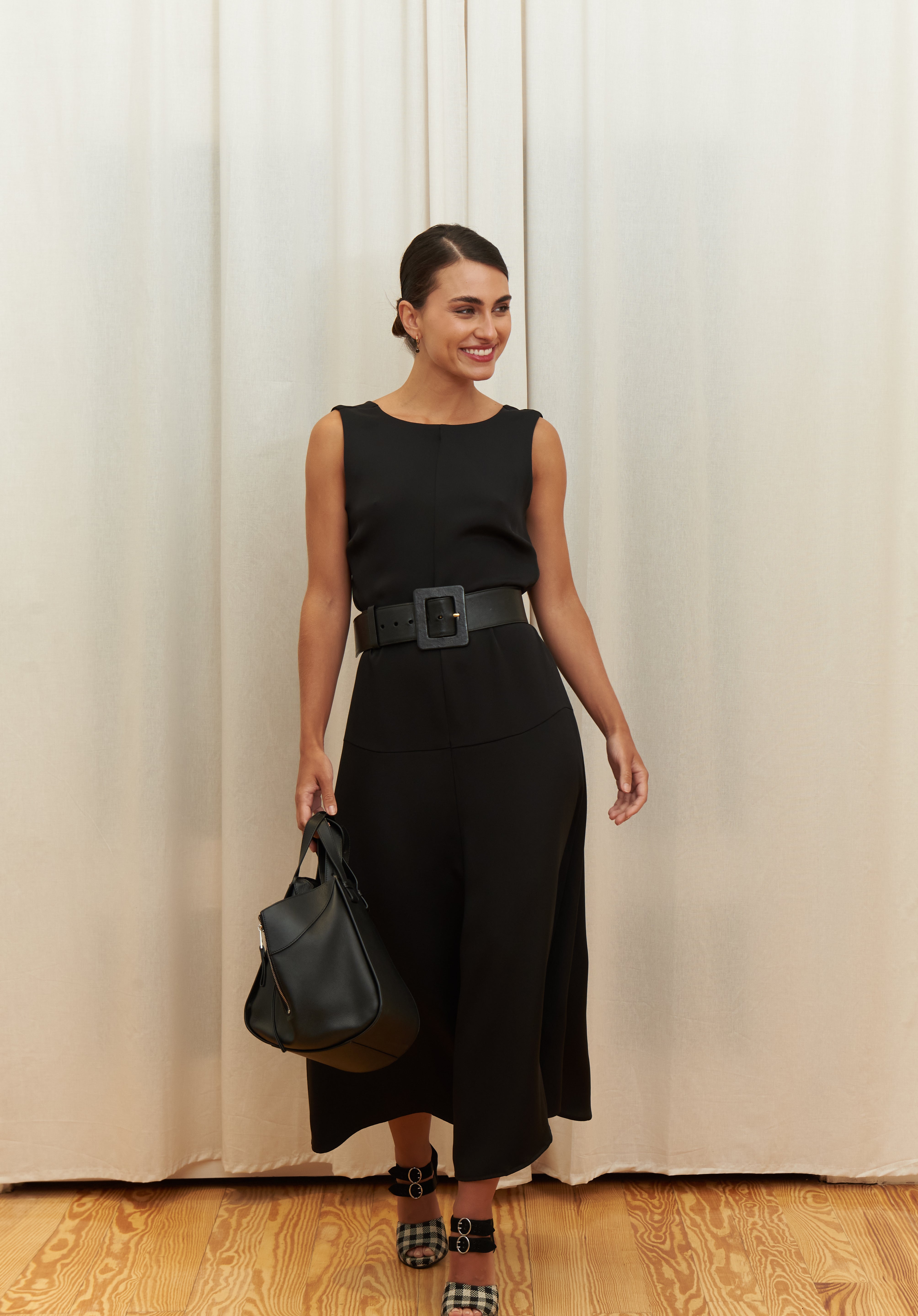Audrey Serenity Gown in 100% certified Como silk features a round neckline and draped open back, offering timeless sophistication for formal occasions.