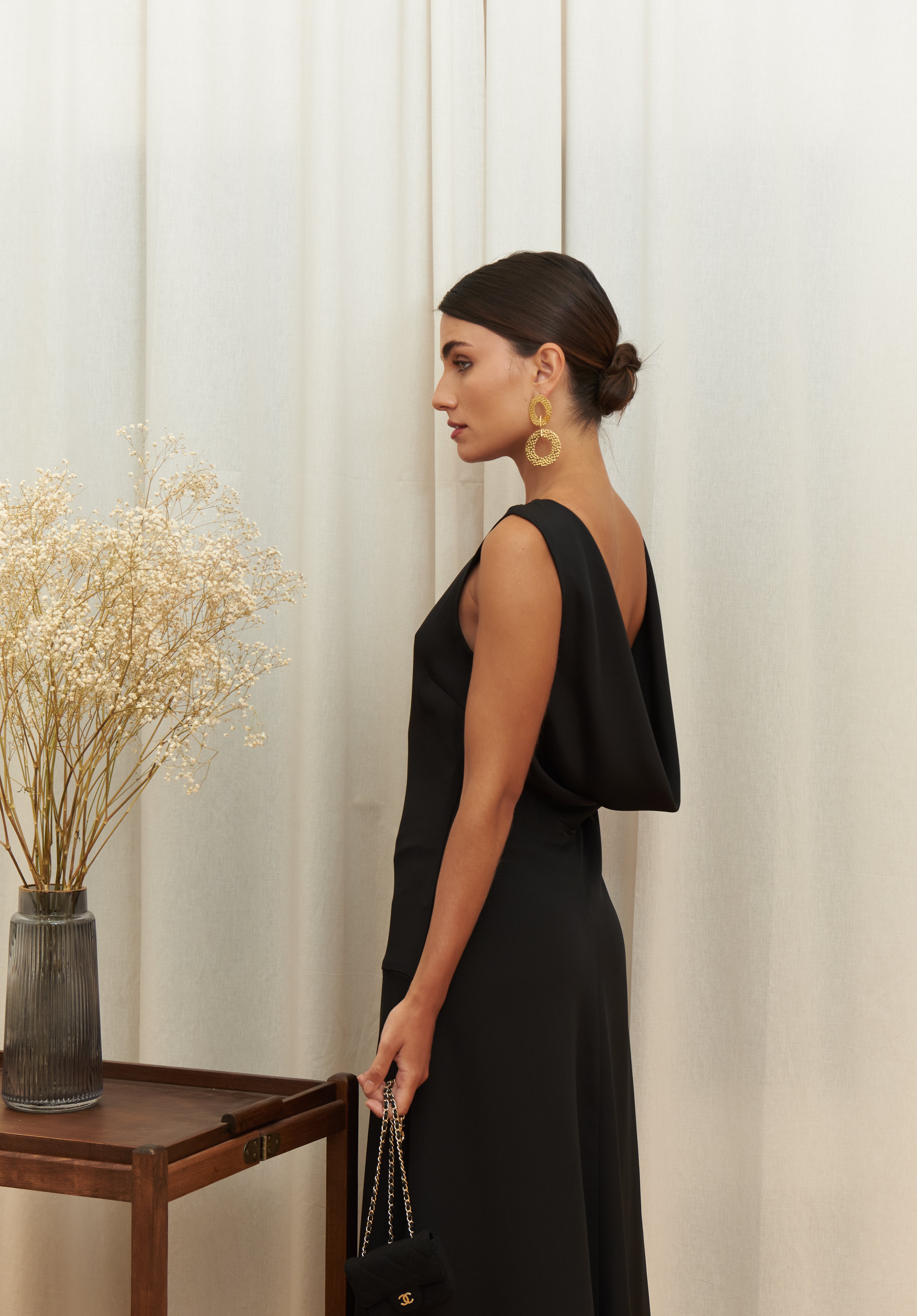 Audrey Serenity Gown in 100% certified Como silk features a round neckline and draped open back, offering timeless sophistication for formal occasions.