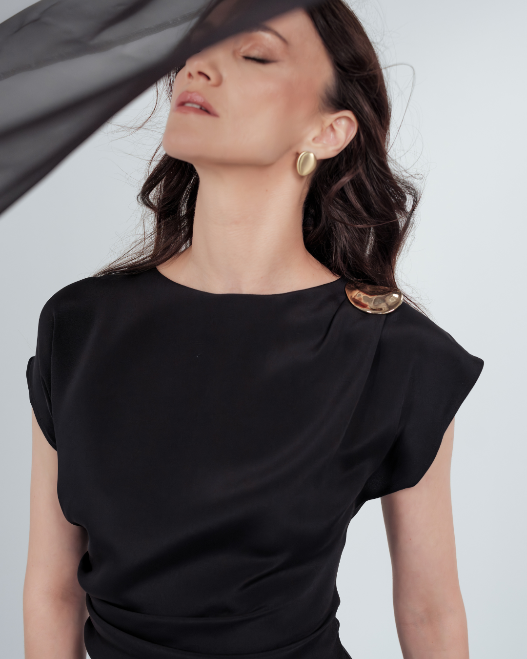 Gilded Mini Dress in 100% certified Como silk features a golden zamak accessory and asymmetrical draping—ideal for cocktail events and evening sophistication.