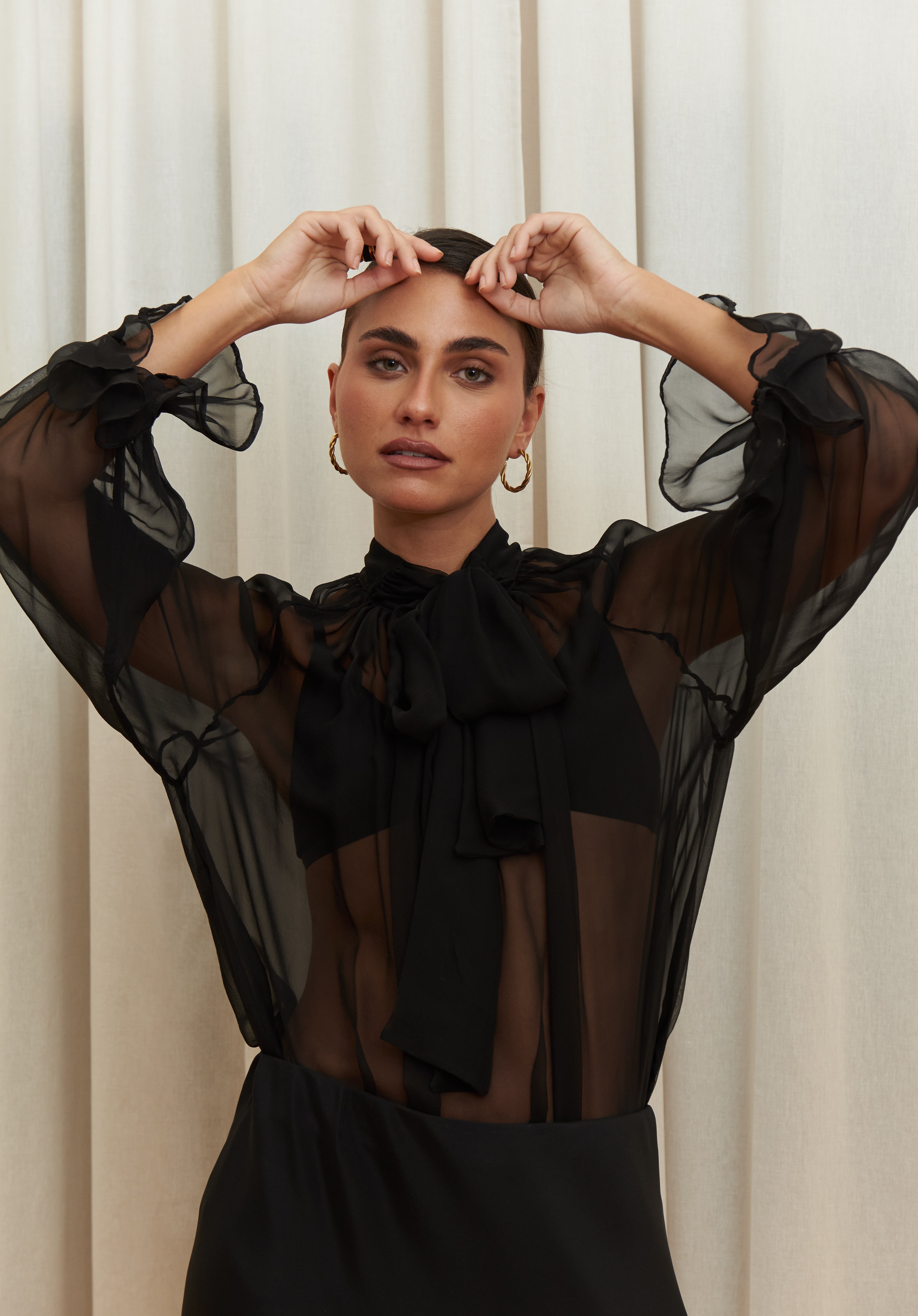 Noir Veil Blouse in 100% certified Como silk voile offers sheer elegance with voluminous sleeves and a delicate necktie—ideal for refined, modern styling.