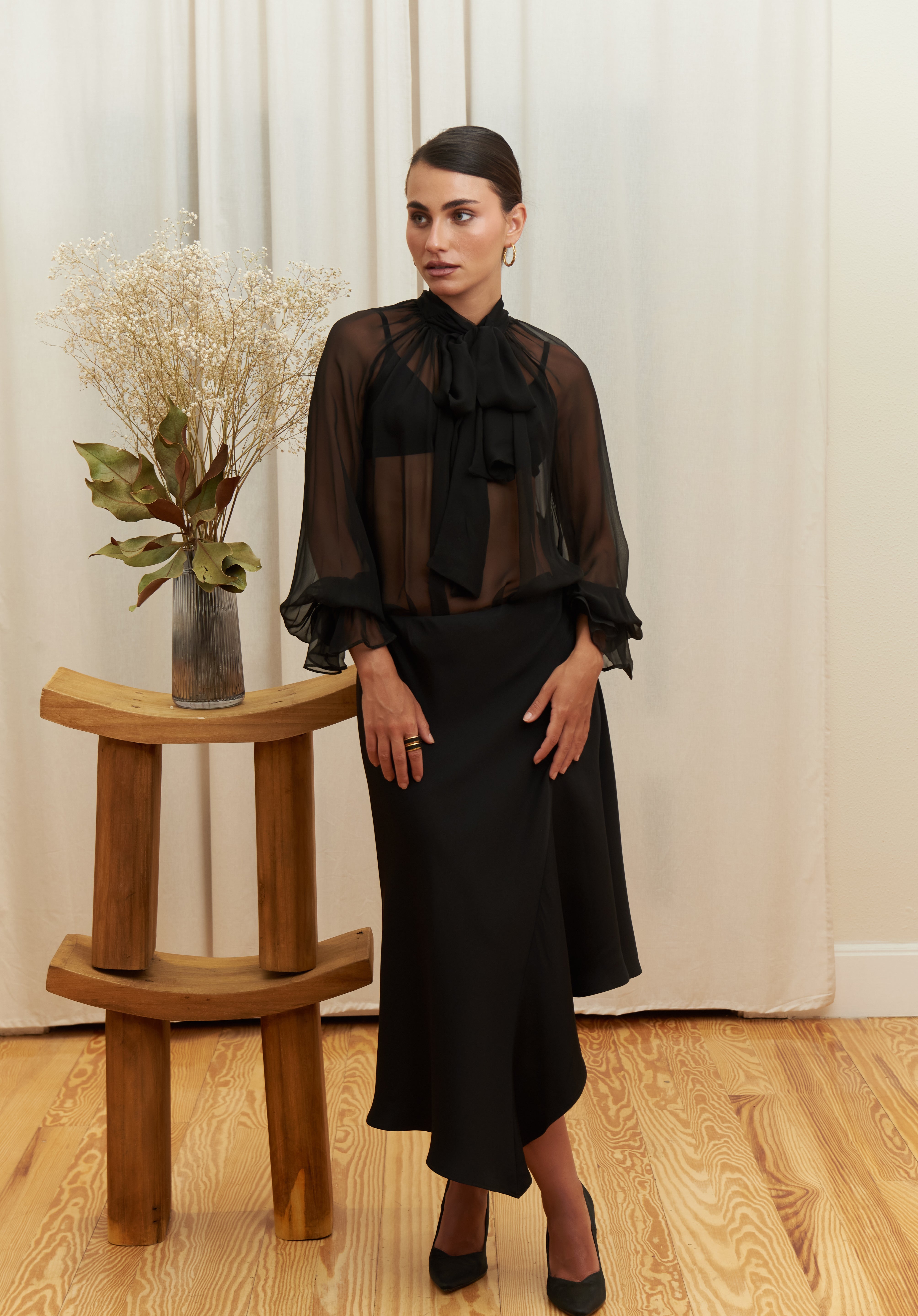 Noir Veil Blouse in 100% certified Como silk voile offers sheer elegance with voluminous sleeves and a delicate necktie—ideal for refined, modern styling.