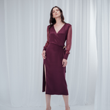 Amethyst Grace Dress in rich burgundy features a golden zamak accessory, sheer sleeves, and silk-covered buttons for opulent sophistication at formal events.