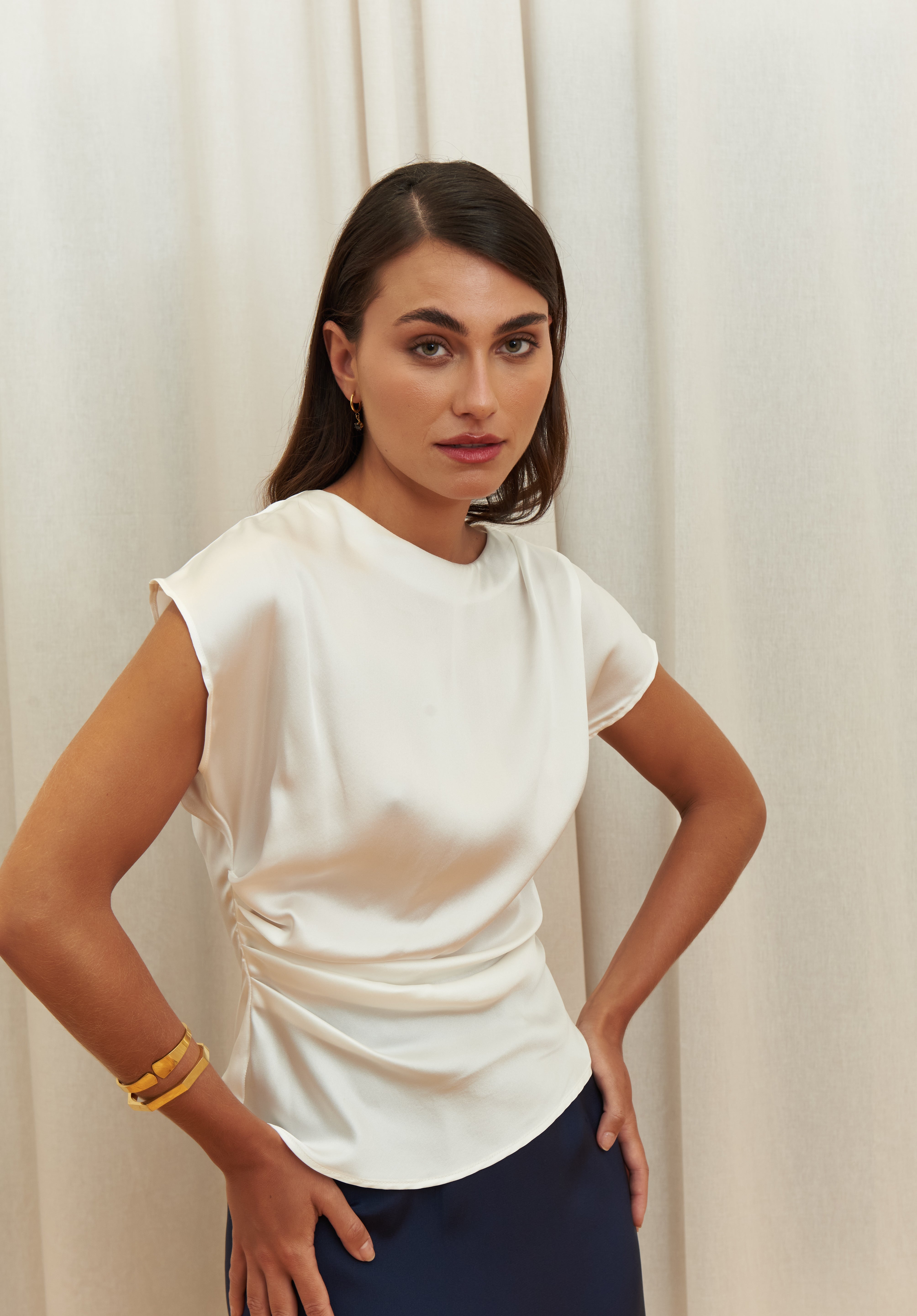 Pearl Draped Top in 100% certified Como silk offers minimalist elegance with delicate draping in white—ideal for versatile refined styling.