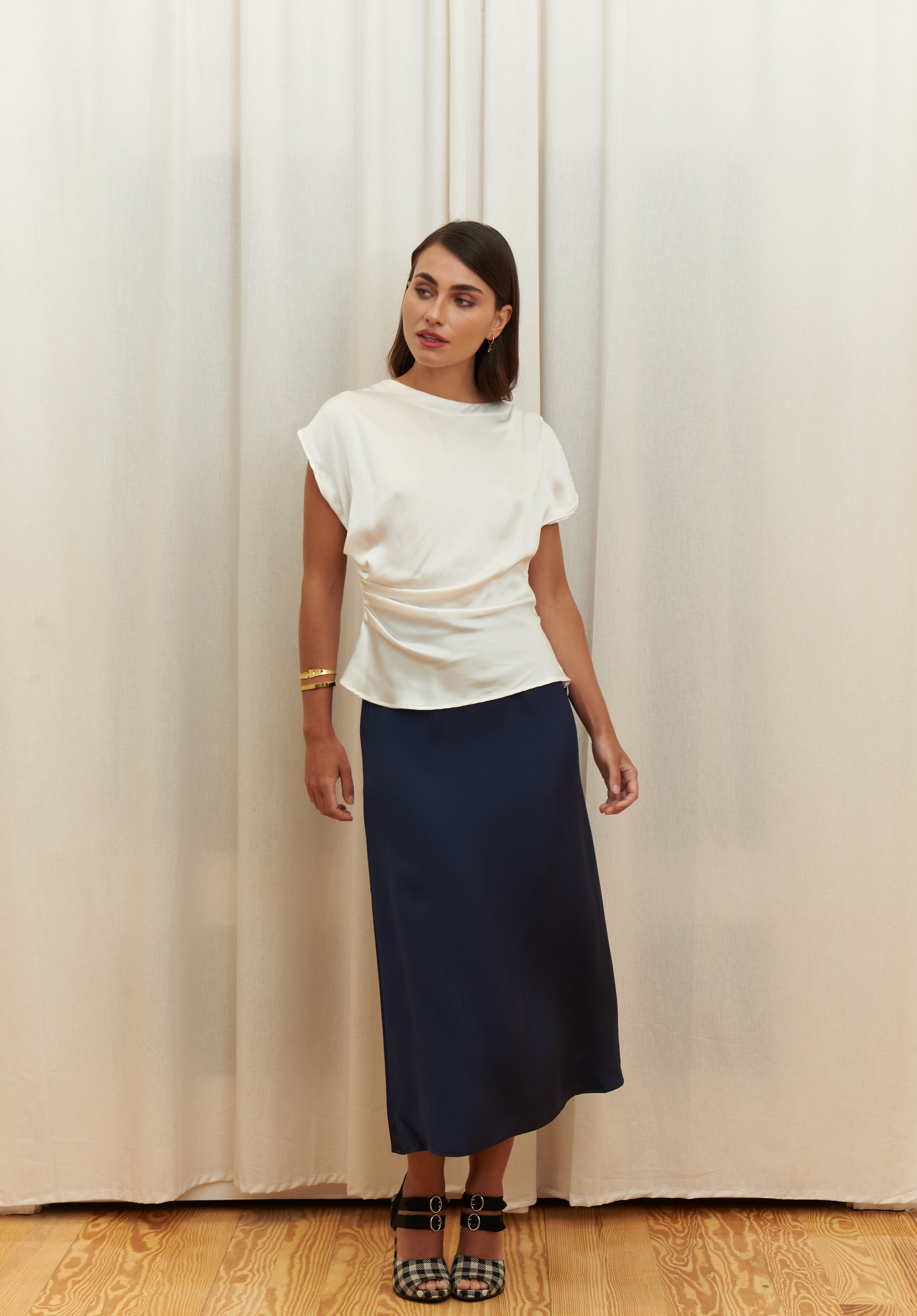 Pearl Draped Top in 100% certified Como silk offers minimalist elegance with delicate draping in white—ideal for versatile refined styling.
