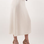 Ivory midi silk skirt – close-up of luxurious 100% silk fabric, precise stitching, and exquisite craftsmanship.