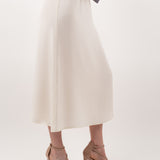 Ivory midi silk skirt – close-up of luxurious 100% silk fabric, precise stitching, and exquisite craftsmanship.