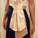 Golden Poise Top in 100% certified Como silk features an asymmetric bow and tailored silhouette, perfect for achieving both professional and evening elegance.