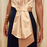 Golden Poise Top in 100% certified Como silk features an asymmetric bow and tailored silhouette, perfect for achieving both professional and evening elegance.