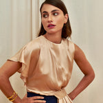 Golden Poise Top in 100% certified Como silk features an asymmetric bow and tailored silhouette, perfect for achieving both professional and evening elegance.