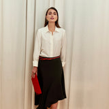 Celeste Cascade Skirt in 100% certified Como silk features an elasticated waistband and cascading hemline, offering refined elegance for day-to-night style.