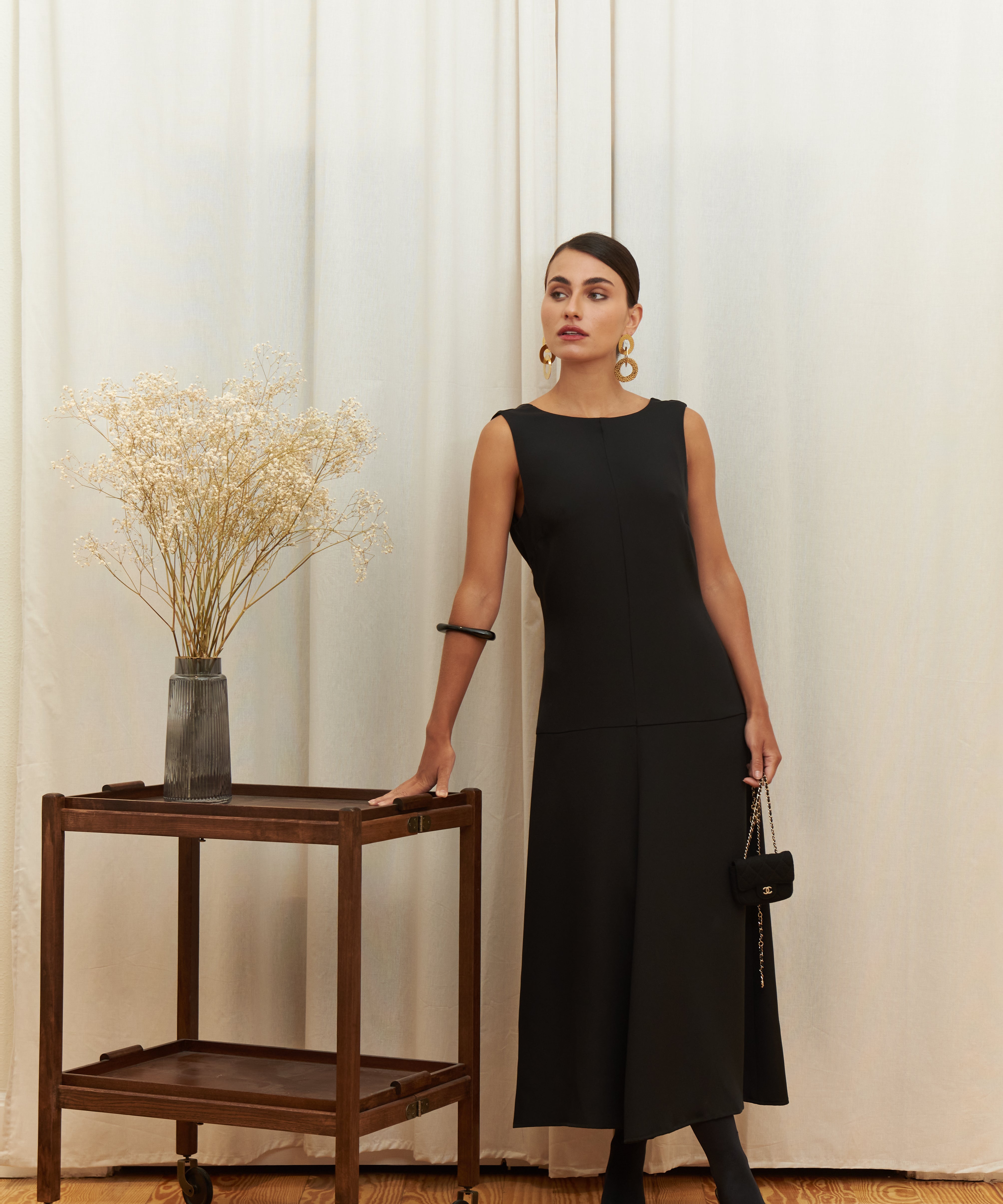 Audrey Serenity Gown in 100% certified Como silk features a round neckline and draped open back, offering timeless sophistication for formal occasions.
