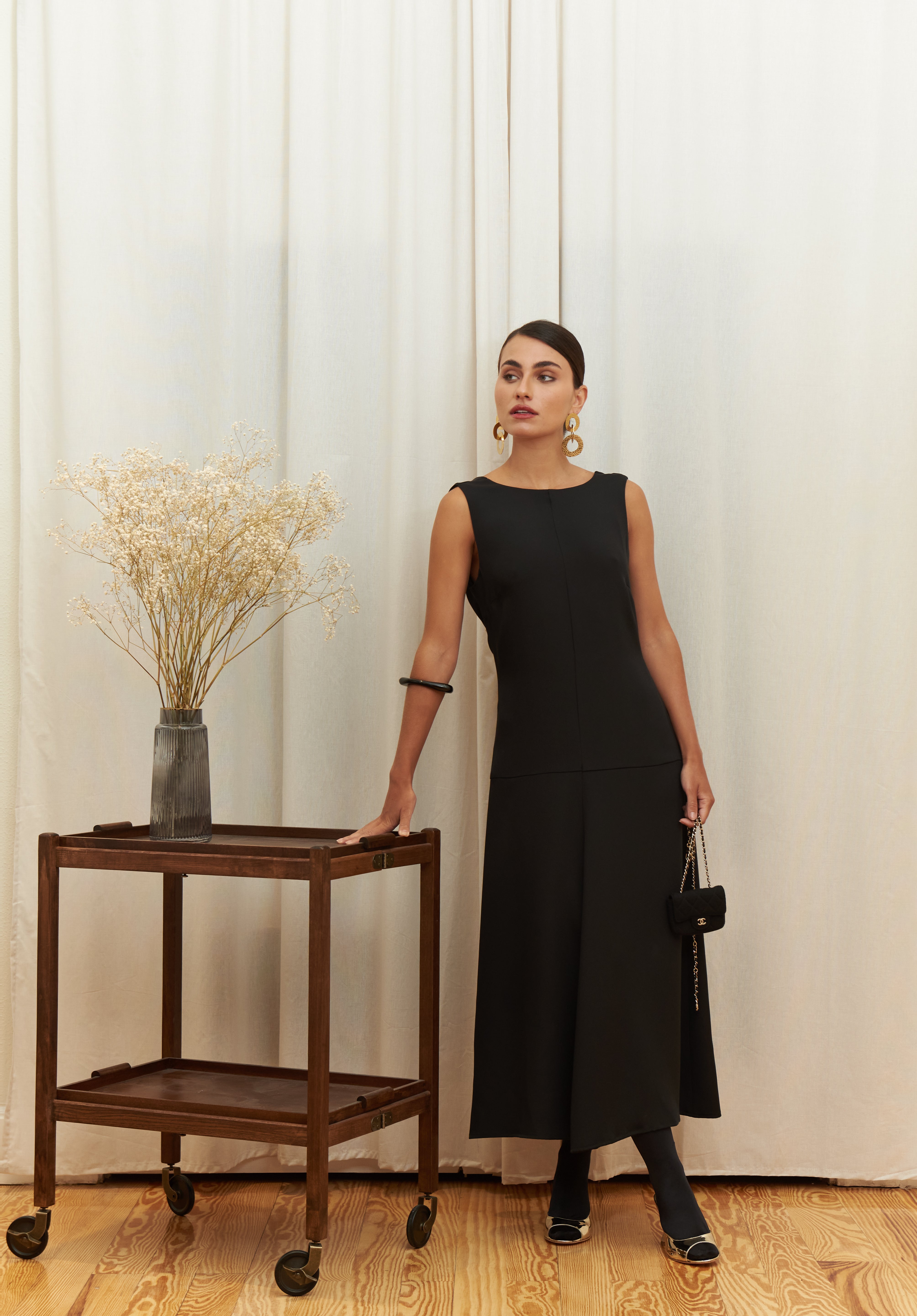 Audrey Serenity Gown in 100% certified Como silk features a round neckline and draped open back, offering timeless sophistication for formal occasions.