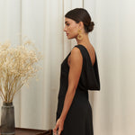 Audrey Serenity Gown in 100% certified Como silk features a round neckline and draped open back, offering timeless sophistication for formal occasions.