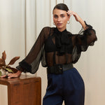 Noir Veil Blouse in 100% certified Como silk voile offers sheer elegance with voluminous sleeves and a delicate necktie—ideal for refined, modern styling.