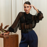 Noir Veil Blouse in 100% certified Como silk voile offers sheer elegance with voluminous sleeves and a delicate necktie—ideal for refined, modern styling.