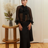Noir Veil Blouse in 100% certified Como silk voile offers sheer elegance with voluminous sleeves and a delicate necktie—ideal for refined, modern styling.
