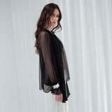 Noir Veil Blouse in 100% certified Como silk voile offers sheer elegance with voluminous sleeves and a delicate necktie—ideal for refined, modern styling.