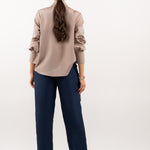 Bronze silk shirt – smooth back design, refined tailoring, and flowing 100% silk fabric for an effortlessly sophisticated look. Back view.