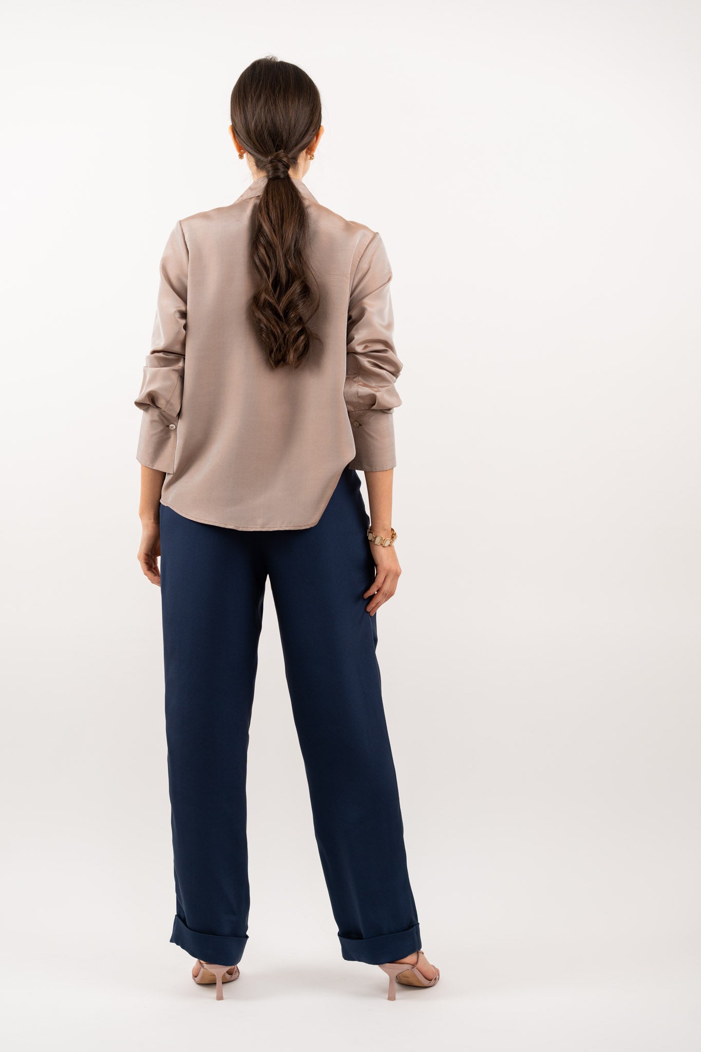 Bronze silk shirt – smooth back design, refined tailoring, and flowing 100% silk fabric for an effortlessly sophisticated look. Back view.