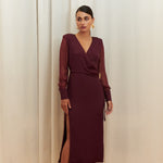 Amethyst Grace Dress in rich burgundy features a golden zamak accessory, sheer sleeves, and silk-covered buttons for opulent sophistication at formal events.