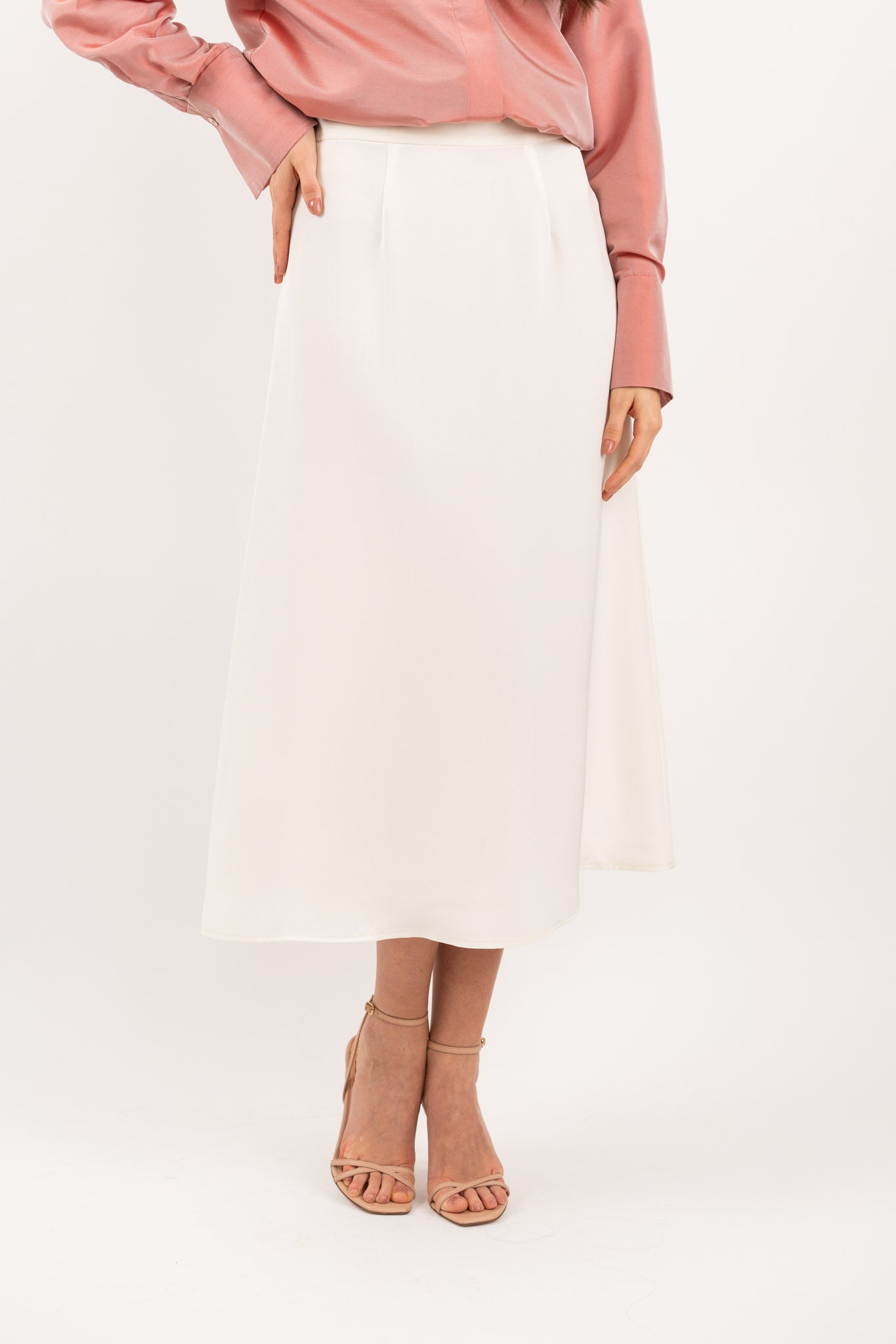 Ivory midi silk skirt – close-up of luxurious 100% silk fabric, precise stitching, and exquisite craftsmanship.
