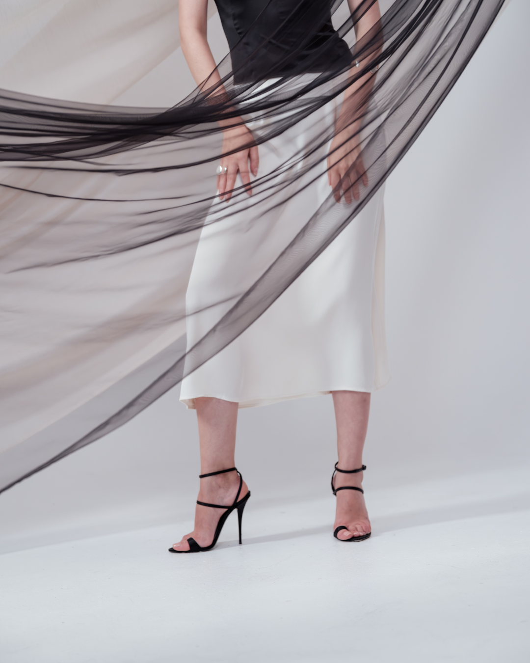 Ivory midi silk skirt – flowing A-line silhouette in 100% silk, flattering drape and graceful movement. Full Side view.