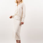 Ivory silk shirt – classic button-up design in 100% silk with an elegant drape and subtle sheen. Front view.