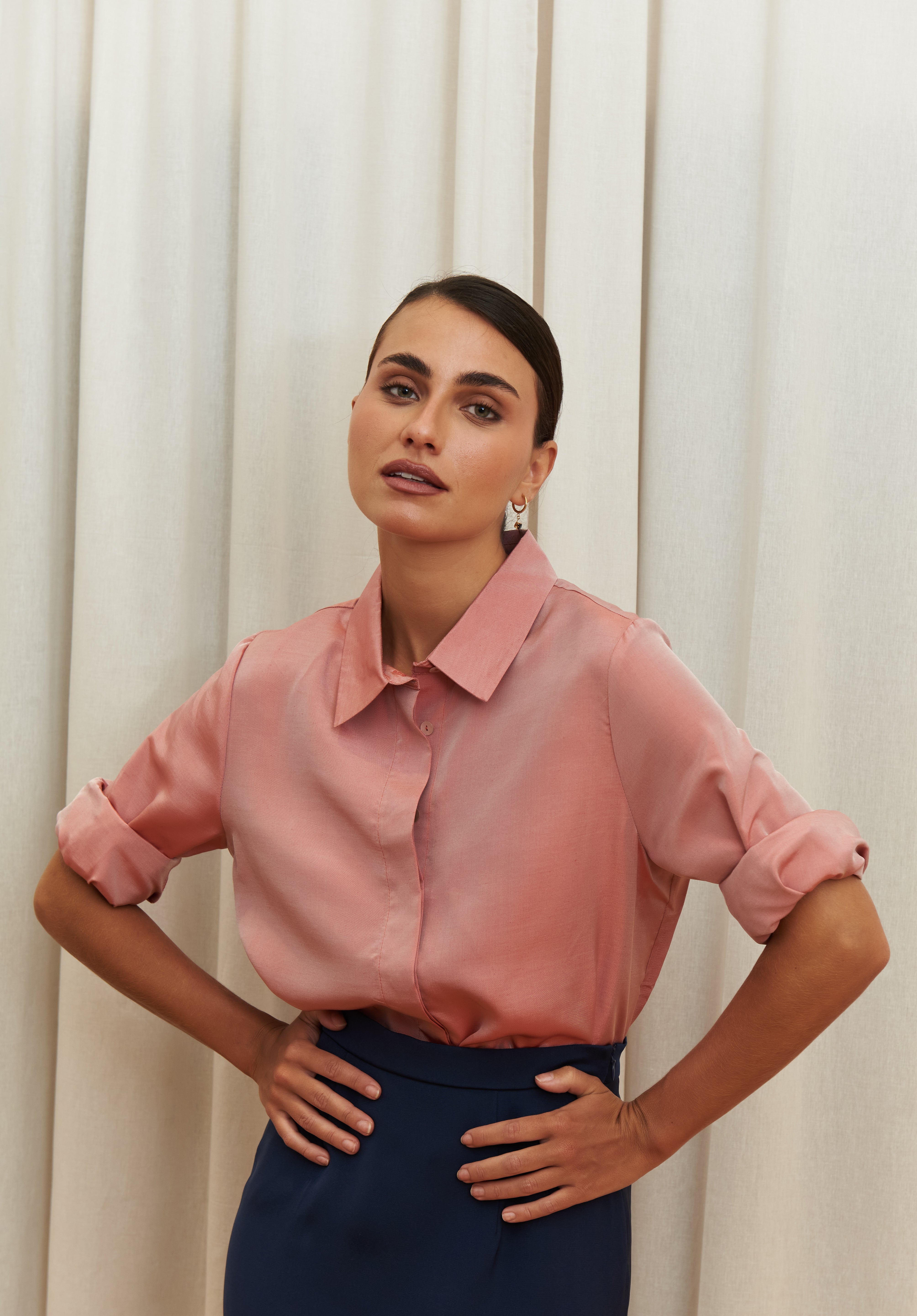 Peach pink silk shirt – soft pastel silk blouse with a relaxed fit and delicate sheen, crafted from 100% silk. Front view.