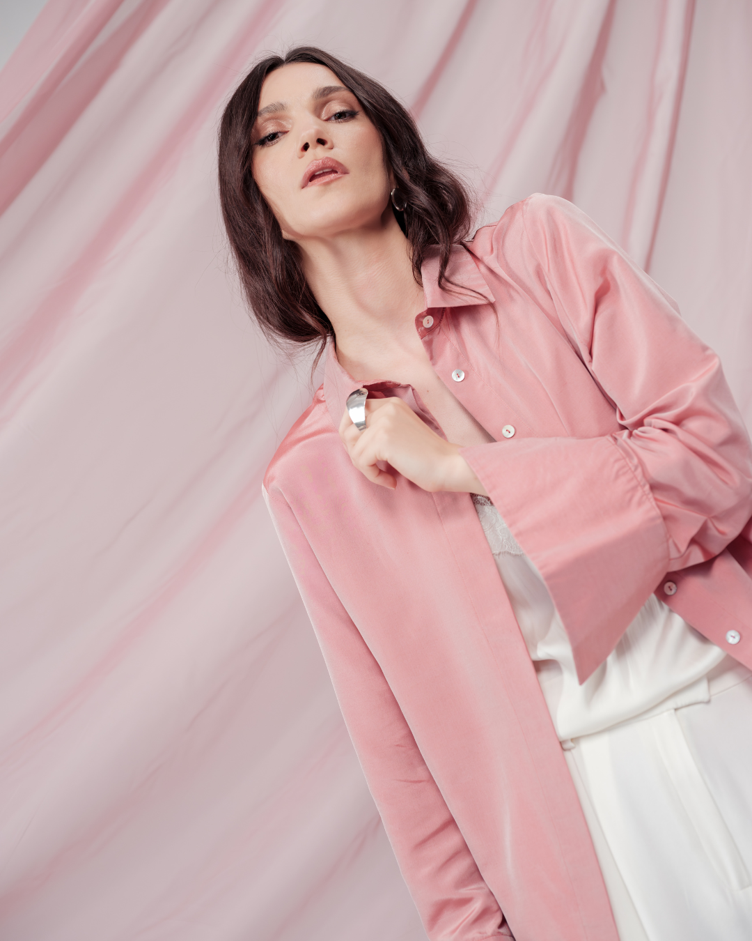 Peach pink silk shirt – soft pastel silk blouse with a relaxed fit and delicate sheen, crafted from 100% silk. Front view.