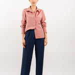 Peach pink silk shirt – soft pastel silk blouse with a relaxed fit and delicate sheen, crafted from 100% silk. Front view.