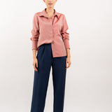 Peach pink silk shirt – soft pastel silk blouse with a relaxed fit and delicate sheen, crafted from 100% silk. Front view.