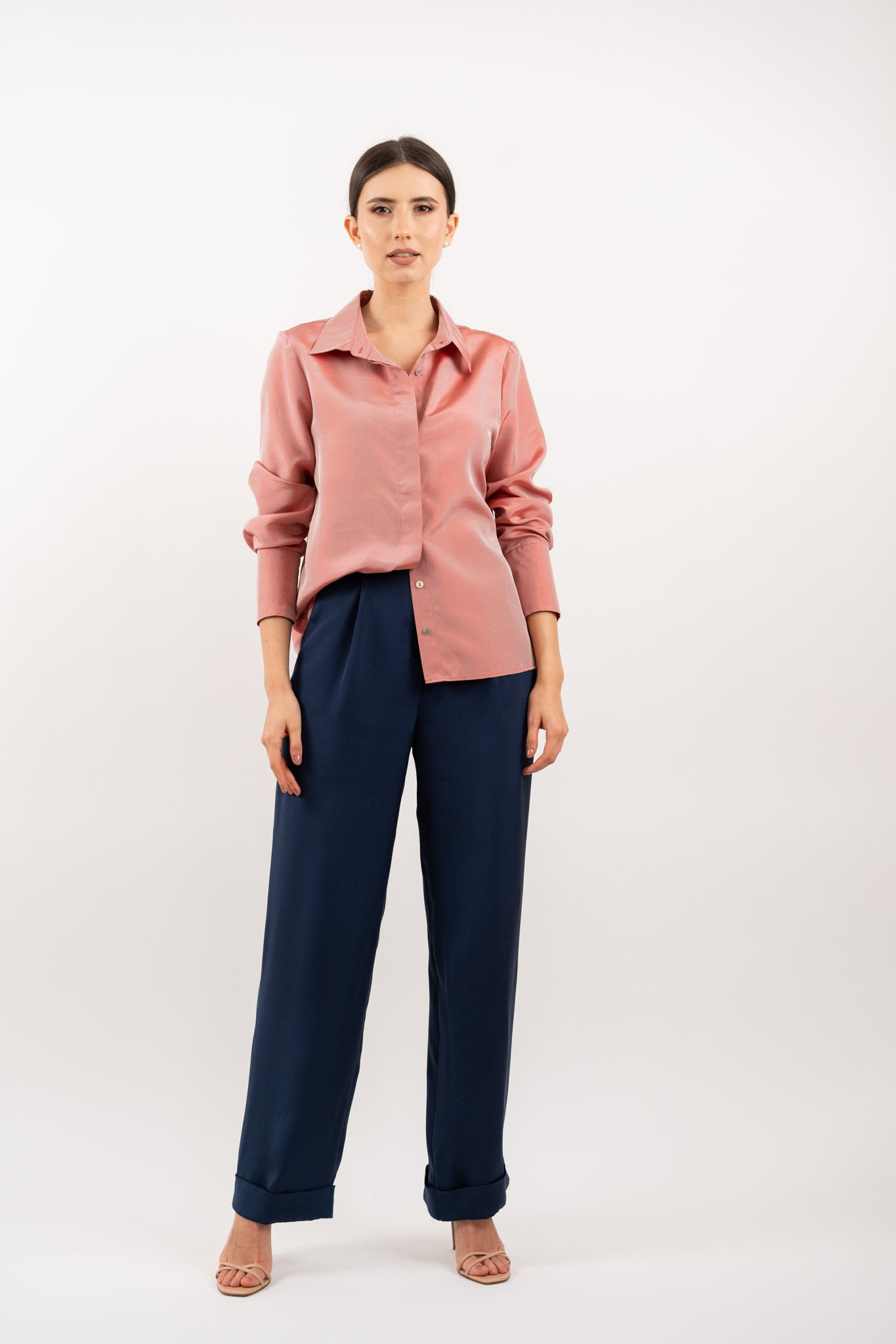 Peach pink silk shirt – soft pastel silk blouse with a relaxed fit and delicate sheen, crafted from 100% silk. Front view.