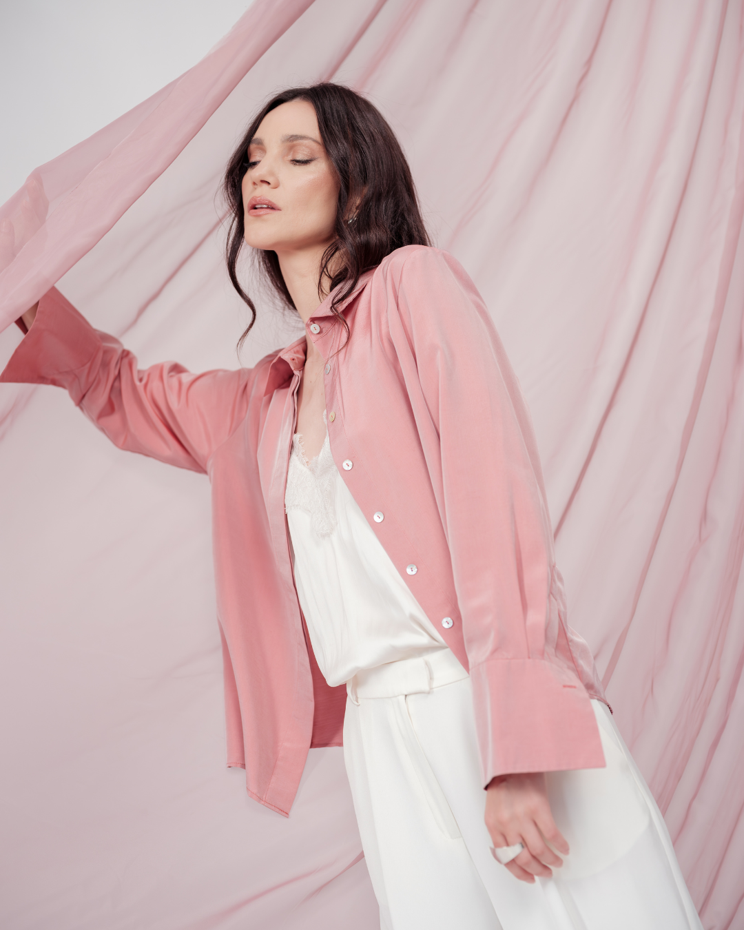 Peach pink silk shirt – soft pastel silk blouse with a relaxed fit and delicate sheen, crafted from 100% silk. Front view.