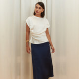 Pearl Draped Top in 100% certified Como silk offers minimalist elegance with delicate draping in white—ideal for versatile refined styling.