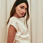 Pearl Draped Top in 100% certified Como silk offers minimalist elegance with delicate draping in white—ideal for versatile refined styling.